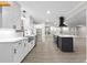 Bright, open kitchen with white cabinets, an island, and stainless steel appliances at 4145 White Oak Dr, Winston, GA 30187