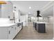 Well-lit kitchen featuring white countertops, stainless steel appliances, and dark island at 4145 White Oak Dr, Winston, GA 30187
