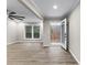 Bright living room features neutral walls, ceiling fan, and modern flooring at 4145 White Oak Dr, Winston, GA 30187
