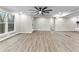 Expansive living area featuring sleek floors and open layout to nearby kitchen at 4145 White Oak Dr, Winston, GA 30187