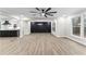 Inviting living space with modern floors, recessed lighting, and views to kitchen at 4145 White Oak Dr, Winston, GA 30187