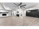 Open concept living space connects to kitchen, featuring fireplace and modern lighting at 4145 White Oak Dr, Winston, GA 30187