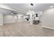 Spacious living space featuring hardwood floors and an open layout to the kitchen and second living area at 4145 White Oak Dr, Winston, GA 30187