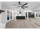 Stunning living area featuring fireplace, kitchen, and formal dining space with hardwood floors at 4145 White Oak Dr, Winston, GA 30187