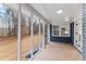 Enclosed porch with tile floor overlooks the backyard at 4145 White Oak Dr, Winston, GA 30187