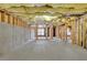 Unfinished basement with exposed ceiling insulation and framing for future customization and personalization at 2111 Fernbank Way, Dacula, GA 30019