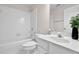Clean, bright bathroom with white tile, tub-shower combo, and modern vanity at 2111 Fernbank Way, Dacula, GA 30019