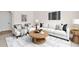 Comfortable living room showcases stylish furniture, area rug, and modern decor at 2111 Fernbank Way, Dacula, GA 30019