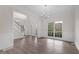 Inviting living room with hardwood floors, large windows, and natural light, blending comfort and style at 2111 Fernbank Way, Dacula, GA 30019
