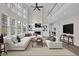 Bright living room with vaulted ceiling, large windows, fireplace, and loft access at 2111 Fernbank Way, Dacula, GA 30019