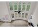 Spacious living room with large windows, hardwood floors, and fireplace with white trim at 2111 Fernbank Way, Dacula, GA 30019