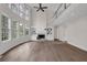 Bright living room with soaring ceilings, fireplace, built-ins, and natural light creating an inviting atmosphere at 2111 Fernbank Way, Dacula, GA 30019