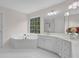 A luxurious bathroom features a jacuzzi tub and ample counter space at 2111 Fernbank Way, Dacula, GA 30019