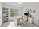 Bright office with a large window, carpet, stylish desk, and built-in shelving at 2111 Fernbank Way, Dacula, GA 30019