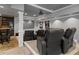 Basement home theater with tiered seating, bar area, and projector screen at 249 Thorncliff Lndg, Acworth, GA 30101