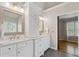Bright bathroom with double vanity, granite countertops, and wooden framed mirrors at 249 Thorncliff Lndg, Acworth, GA 30101