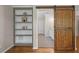 Bathroom featuring a sliding barn door, white shelving, and a tile floor at 249 Thorncliff Lndg, Acworth, GA 30101