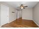 Large bedroom with hardwood floors, neutral walls and ceiling fan along with access to the hall and bathroom at 249 Thorncliff Lndg, Acworth, GA 30101