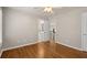 This bedroom boasts hardwood floors, a ceiling fan and an easy access to a private bathroom and hallway at 249 Thorncliff Lndg, Acworth, GA 30101