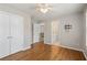 This spacious bedroom has hardwood floors, a ceiling fan, closet and a bathroom entrance for easy access at 249 Thorncliff Lndg, Acworth, GA 30101