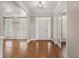 Open foyer showcasing hardwood floors, a white front door, and glass french doors to another room at 249 Thorncliff Lndg, Acworth, GA 30101