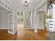 Grand foyer with hardwood floors, staircase, open layout and lots of natural light from the windows at 249 Thorncliff Lndg, Acworth, GA 30101