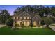 Beautiful brick home featuring manicured landscaping, a covered porch, and a classic architectural design at 249 Thorncliff Lndg, Acworth, GA 30101