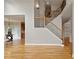 Open floor plan with staircase to upper level, hardwood floors and view into the kitchen at 249 Thorncliff Lndg, Acworth, GA 30101