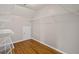 Walk-in closet with hardwood floors, white wire shelving, and bright light at 249 Thorncliff Lndg, Acworth, GA 30101