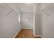 Walk-in closet with hardwood floors, white wire shelving, and natural light at 249 Thorncliff Lndg, Acworth, GA 30101