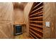 Custom wine cellar featuring a cooling unit and wooden wine racks at 249 Thorncliff Lndg, Acworth, GA 30101