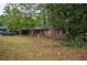 Charming brick home with a spacious front yard and mature trees, offering curb appeal and a serene setting at 3082 Corbin Ave, Decatur, GA 30034