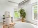 Bedroom area with a modern desk and chair and a large ficus next to the window at 50 Dartmouth Ave, Avondale Estates, GA 30002