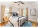 Serene bedroom with hardwood floors, a comfortable bed, and natural light at 50 Dartmouth Ave, Avondale Estates, GA 30002