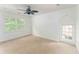 Bedroom with neutral carpet, white walls, and ceiling fan at 50 Dartmouth Ave, Avondale Estates, GA 30002
