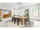 Open-concept dining room seamlessly connects to the kitchen, featuring modern decor and ample space at 50 Dartmouth Ave, Avondale Estates, GA 30002