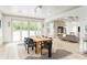 Elegant dining room with modern lighting, a large table, and access to a bright living area, perfect for entertaining at 50 Dartmouth Ave, Avondale Estates, GA 30002