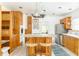Bright kitchen with custom wood cabinets, an island with seating, and stainless steel appliances at 50 Dartmouth Ave, Avondale Estates, GA 30002