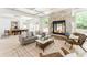 Spacious living room with stone fireplace, coffered ceilings, and an open dining area, perfect for modern living at 50 Dartmouth Ave, Avondale Estates, GA 30002
