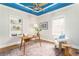 Charming office featuring a cozy chair, ample storage, and hardwood floors at 50 Dartmouth Ave, Avondale Estates, GA 30002