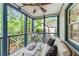 Relaxing covered front porch with stylish furniture, offering a serene outdoor space to enjoy the view at 50 Dartmouth Ave, Avondale Estates, GA 30002