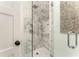 Stylish bathroom with a glass-enclosed shower and marble tile at 50 Dartmouth Ave, Avondale Estates, GA 30002
