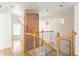 Beautiful staircase with wood railing and decorative iron spindles at 50 Dartmouth Ave, Avondale Estates, GA 30002