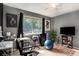 Bedroom with a large window, neutral walls, and a ceiling fan for added comfort at 1418 Foxhall Se Ln # 18, Atlanta, GA 30316
