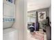 Laundry area with stacked washer/dryer adjacent to bedroom and natural light from window at 1418 Foxhall Se Ln # 18, Atlanta, GA 30316