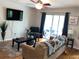 Bright living room featuring a sliding glass door to the outdoor area, hardwood floors, and stylish decor at 1418 Foxhall Se Ln # 18, Atlanta, GA 30316