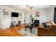 Cozy living room with a hardwood floor, sofa, TV, and ample space for relaxation and entertainment at 1418 Foxhall Se Ln # 18, Atlanta, GA 30316