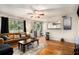Open-concept living area with hardwood floors, comfortable seating, and a view of the outdoors at 1418 Foxhall Se Ln # 18, Atlanta, GA 30316