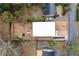 Birds eye view of modern home with white roof, spacious yard, and private driveway at 2402 Lynn Iris Dr, Decatur, GA 30032