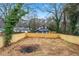 View of a partially fenced in backyard with an interesting natural setting at 2402 Lynn Iris Dr, Decatur, GA 30032